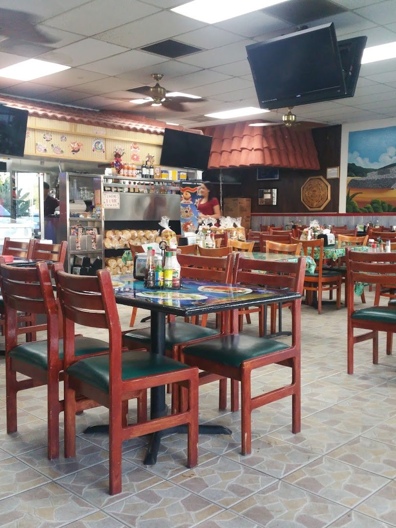 A spread of tacos and shrimp dishes.