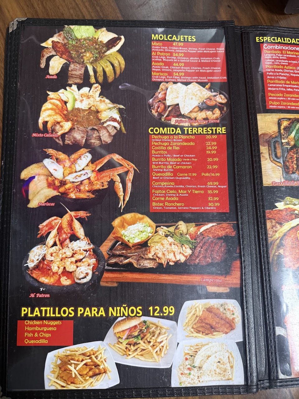 Printed menu with tacos and shrimp dishes.
